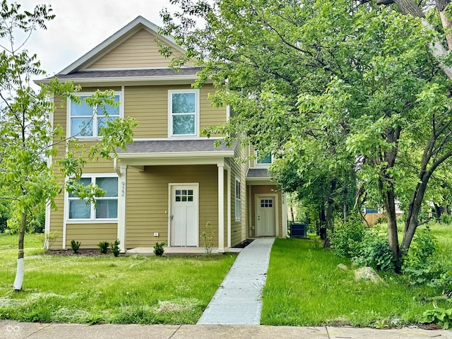 924 N Oakland Ave, Indianapolis, IN 46201 - view of front of house featuring a front lawn, cooling unit, and a shingled roof