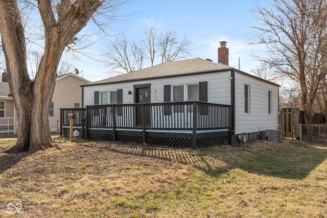 back of house with a deck, central AC, a chimney, and fence