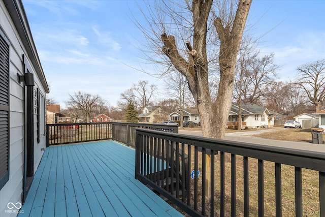 wooden terrace with a residential view