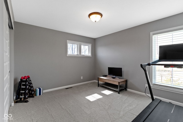 workout room with visible vents, baseboards, and carpet