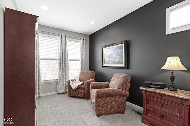 sitting room with visible vents, recessed lighting, light colored carpet, and baseboards