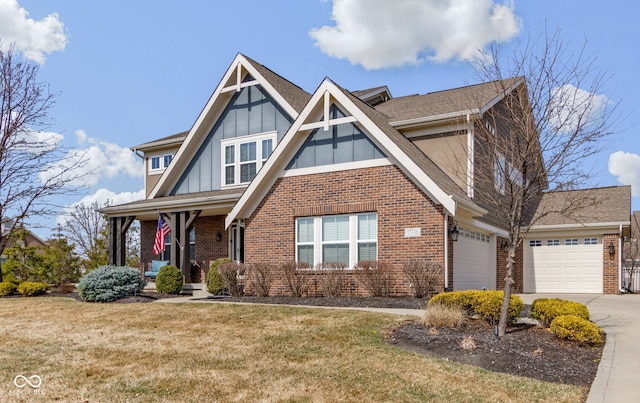 view of front of home with driveway, brick siding, a front lawn, a garage, and board and batten siding