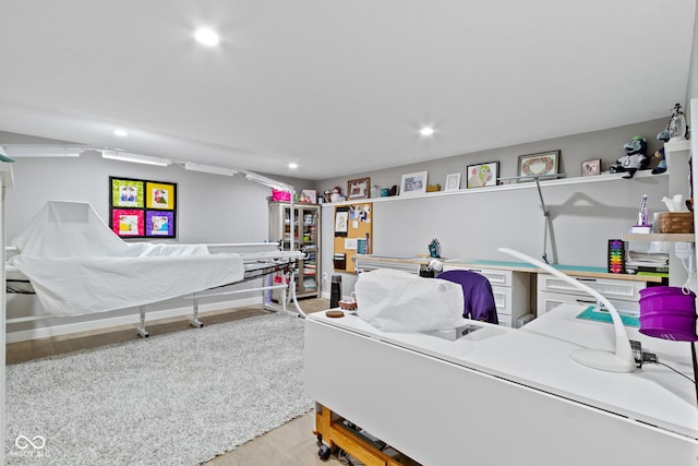 bedroom with recessed lighting and wood finished floors