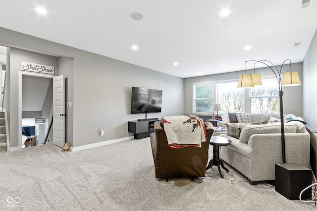 carpeted living area featuring visible vents, recessed lighting, stairs, and baseboards