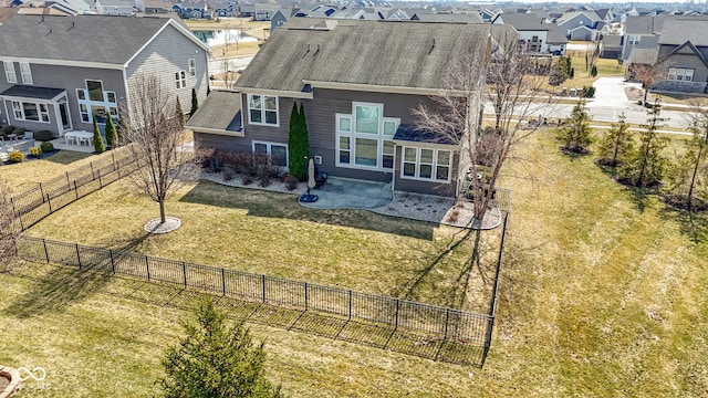 birds eye view of property with a residential view