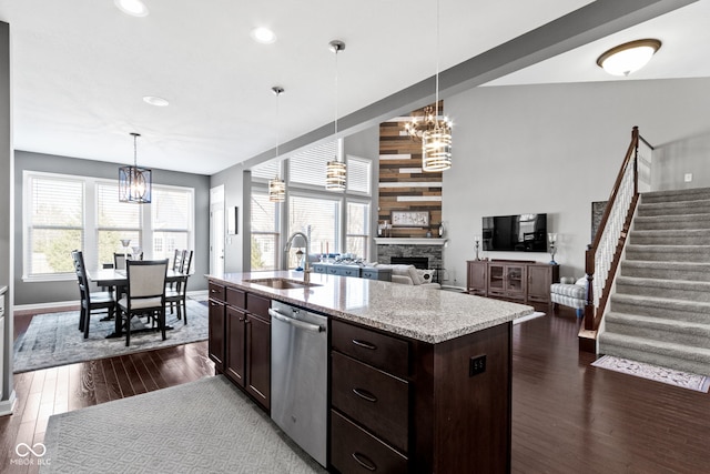 kitchen with dark brown cabinets, dark wood-type flooring, dishwasher, an inviting chandelier, and a sink