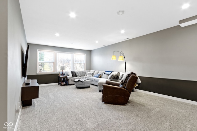 carpeted living room featuring recessed lighting and baseboards