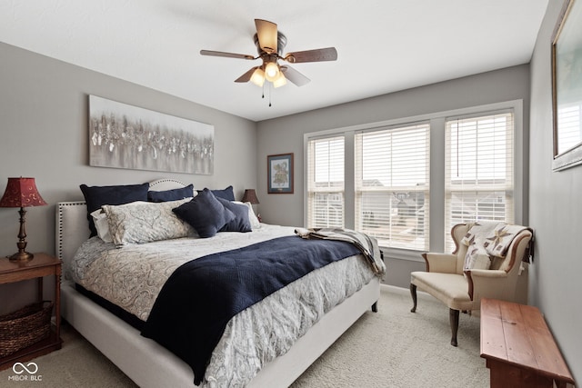 carpeted bedroom with a ceiling fan