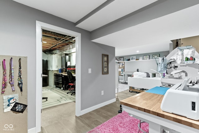 interior space featuring baseboards and wood finished floors