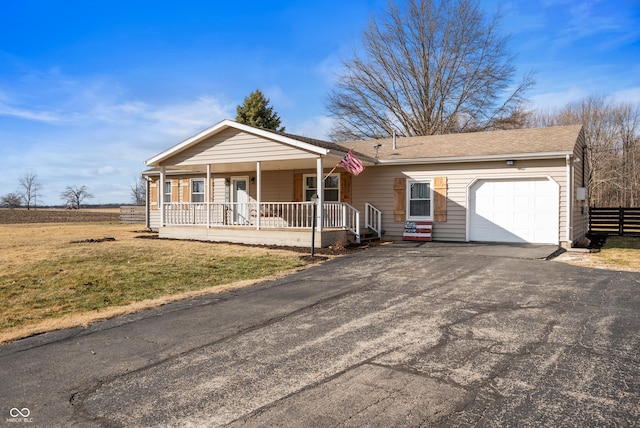 ranch-style house featuring aphalt driveway, a porch, a front yard, fence, and a garage