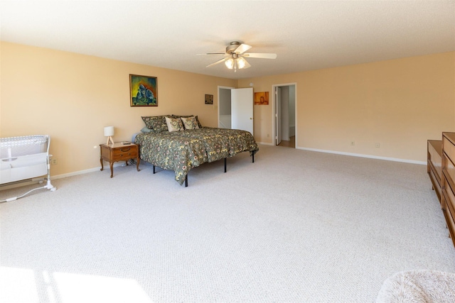 bedroom with carpet flooring, a ceiling fan, and baseboards