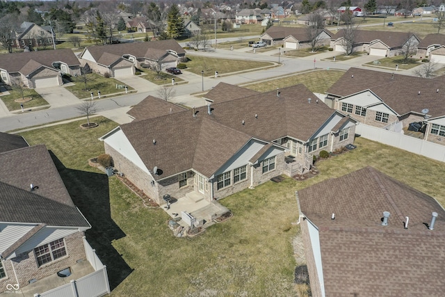 birds eye view of property with a residential view