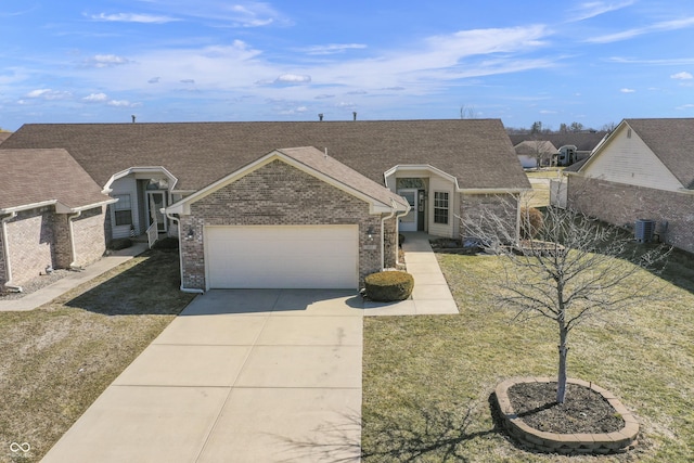 view of front facade featuring brick siding, concrete driveway, a front yard, roof with shingles, and a garage