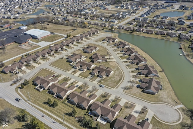 bird's eye view featuring a residential view and a water view