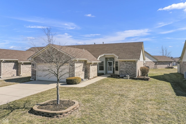 view of front facade featuring a front yard, roof with shingles, concrete driveway, a garage, and brick siding