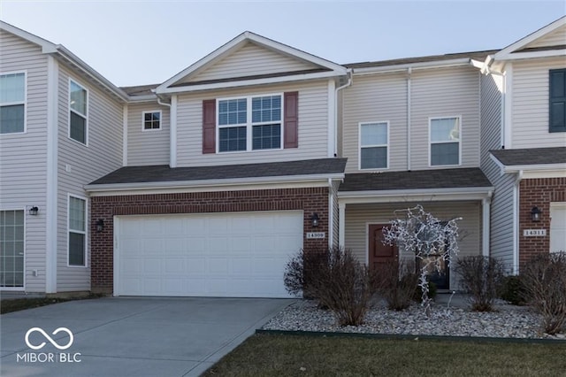 14309 Shooting Star Dr, Noblesville, IN 46060 - multi unit property with concrete driveway, a garage, and brick siding