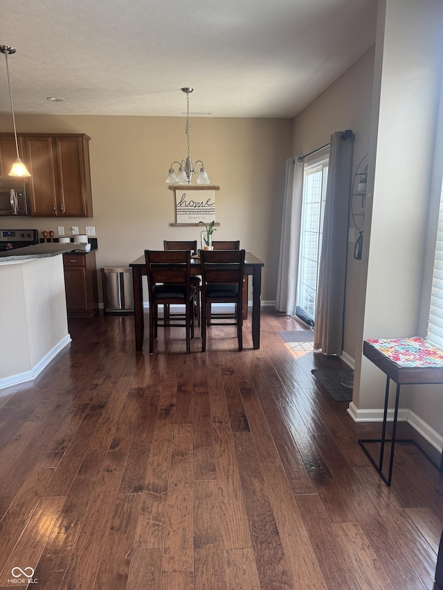 14309 Shooting Star Dr, Noblesville, IN 46060 - dining area with dark wood-type flooring and a chandelier