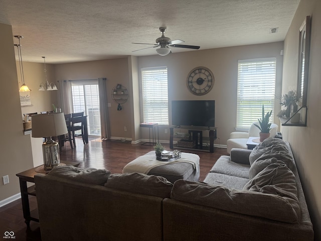 14309 Shooting Star Dr, Noblesville, IN 46060 - living area with dark wood-type flooring, ceiling fan, and a textured ceiling