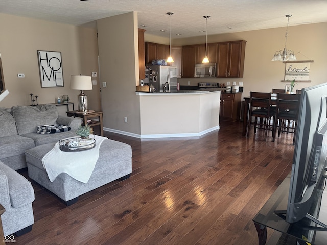 14309 Shooting Star Dr, Noblesville, IN 46060 - living room with dark wood finished floors and a chandelier