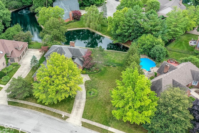 birds eye view of property with a water view and a residential view