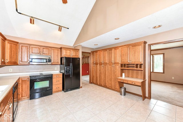 kitchen featuring light carpet, baseboards, light countertops, black appliances, and high vaulted ceiling