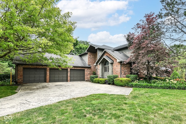 view of front facade featuring brick siding, roof with shingles, concrete driveway, a front yard, and a garage