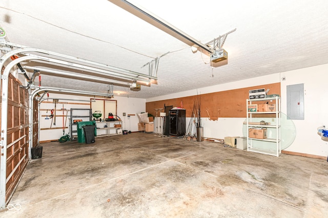 garage with electric panel, baseboards, and a garage door opener