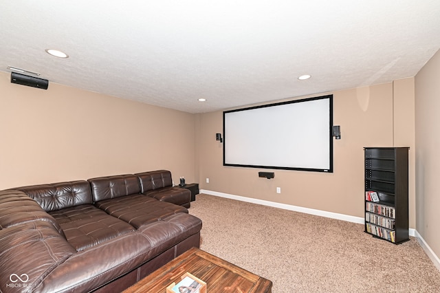 carpeted home theater room with recessed lighting, a textured ceiling, and baseboards