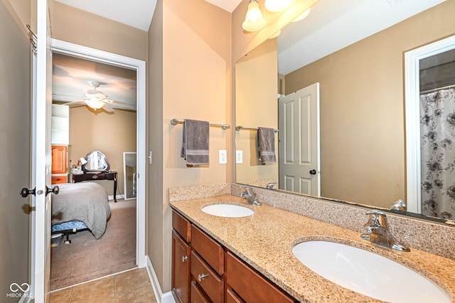 full bath with a sink, ensuite bath, double vanity, and tile patterned floors