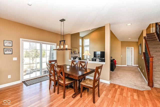 dining space with stairway, recessed lighting, light wood-type flooring, and baseboards