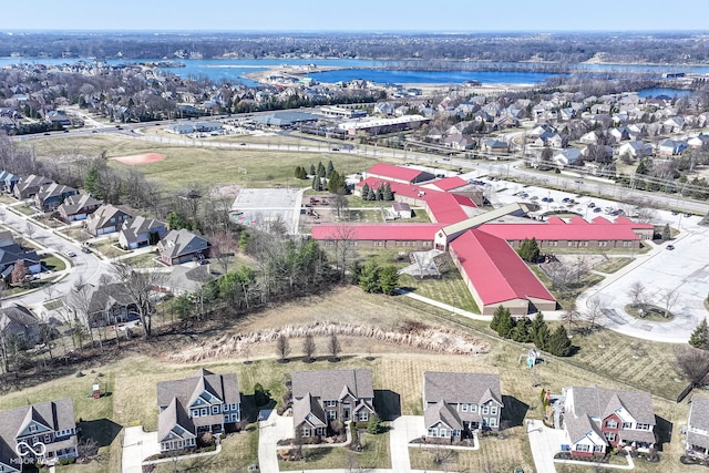 bird's eye view featuring a residential view and a water view