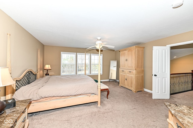 bedroom featuring ceiling fan, baseboards, and light carpet