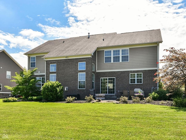 14034 Wicklow Ln, Fishers, IN 46040 - rear view of house with brick siding and a lawn
