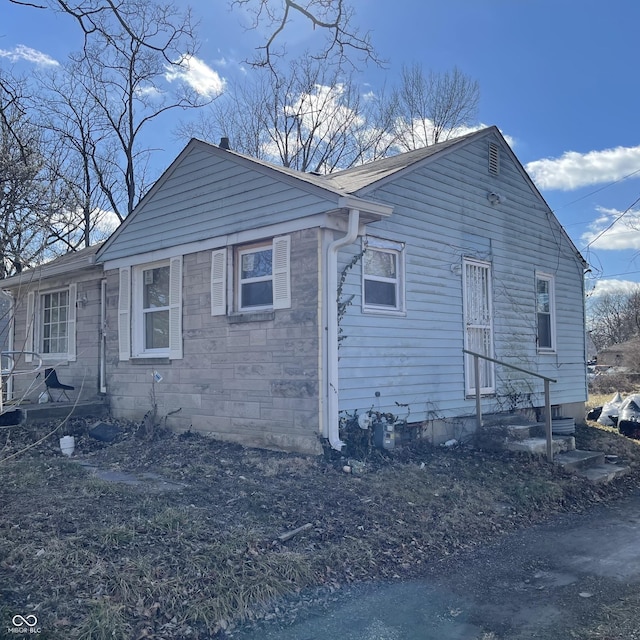 view of property exterior with entry steps