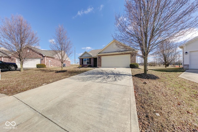 single story home with driveway, a garage, and brick siding