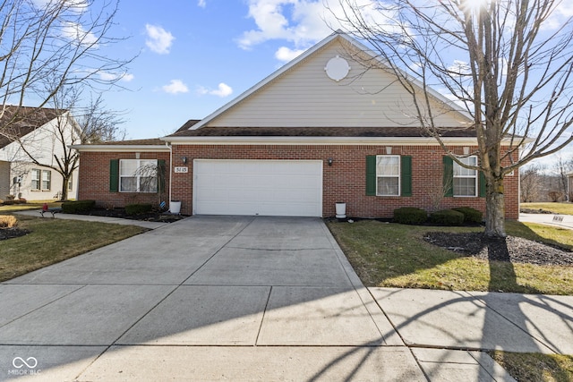 view of front of house featuring an attached garage, driveway, a front yard, and brick siding