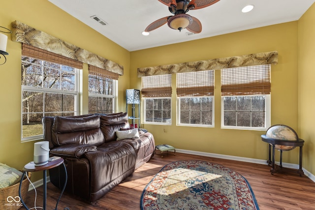 interior space with a ceiling fan and visible vents