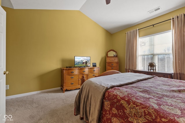 carpeted bedroom with lofted ceiling, baseboards, visible vents, and ceiling fan