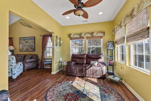 interior space featuring recessed lighting, wood finished floors, a ceiling fan, and baseboards