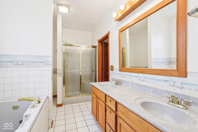 full bath featuring double vanity, tile patterned flooring, a sink, and a shower stall