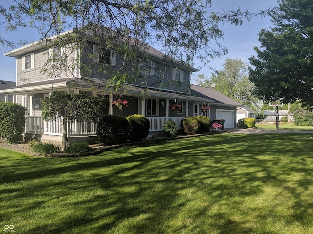 farmhouse inspired home featuring a porch, a front lawn, and an attached garage