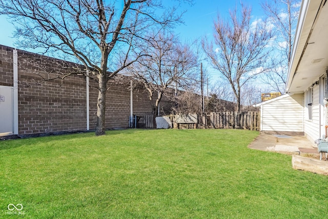 view of yard with a patio area and a fenced backyard