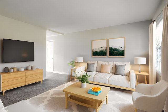 carpeted living room with a wealth of natural light and baseboards