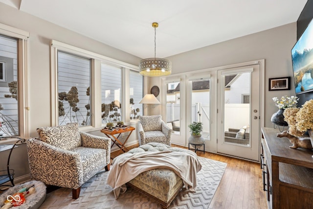 sitting room with light wood finished floors and baseboards