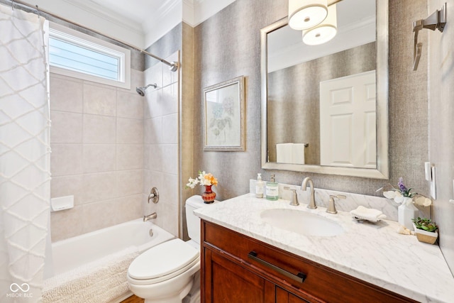 bathroom with vanity, toilet, shower / tub combo with curtain, and ornamental molding