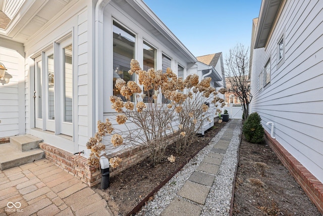 view of home's exterior with fence