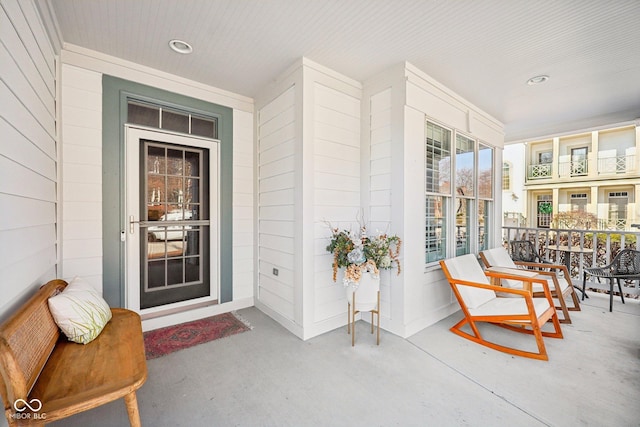 entrance to property featuring covered porch