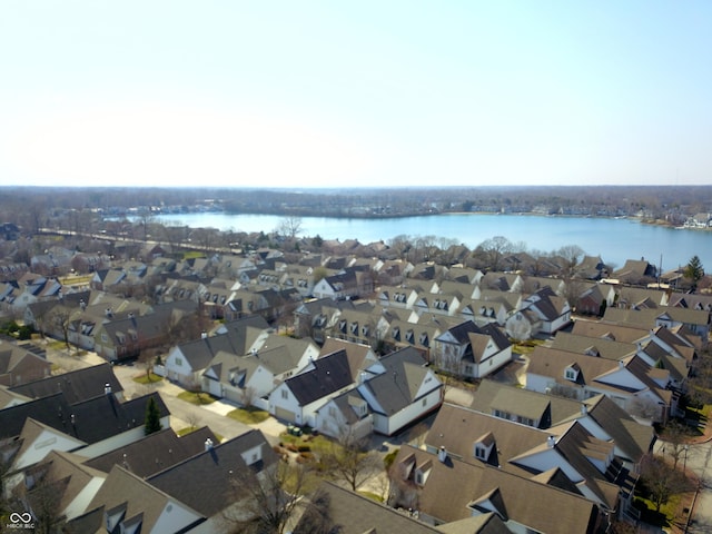 drone / aerial view with a residential view and a water view