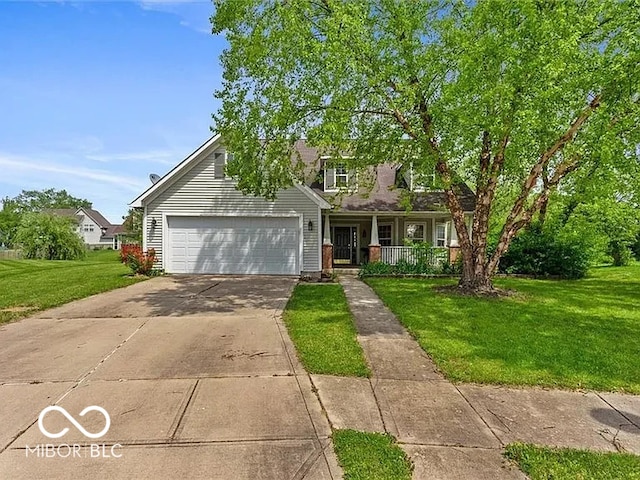 view of front facade with covered porch, an attached garage, concrete driveway, and a front yard