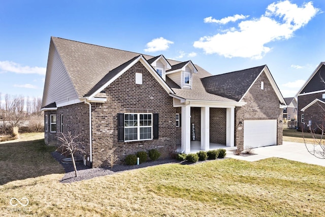 view of front of home featuring a garage, a front yard, concrete driveway, and brick siding